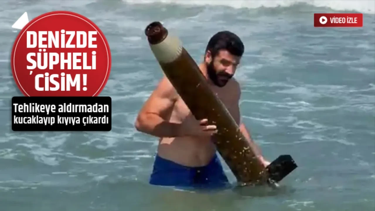 DENİZDE BULDUĞU FÜZE PARÇASINI KIYIYA ÇIKARDI