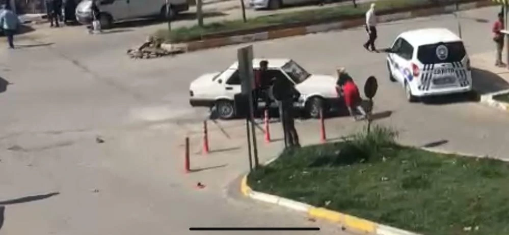 Tartıştığı kadının üzerine otomobilini sürdü