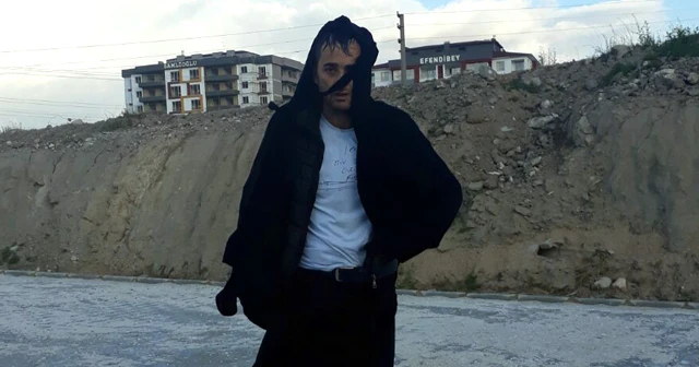 Aranan adam çarşafla dolaşırken yakalandı