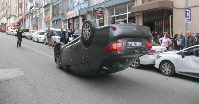 Takla atan otomobilden burnu bile kanamadan kurtuldu