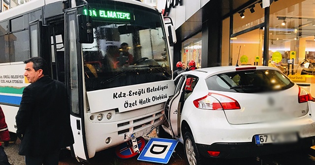 Otobüsün sürüklediği otomobil mağazaya girmekten son anda kurtuldu