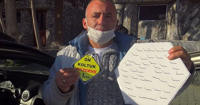 Ön koltuğa oturmasınlar diye çivilerle 'korona savar' yaptı
