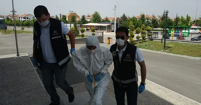 Gözaltına alınan şüpheli adliyeye özel koruyucu kıyafetle getirildi