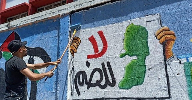Filistinli gençler, İsrail&#039;in ilhakını grafiti çizerek protesto etti