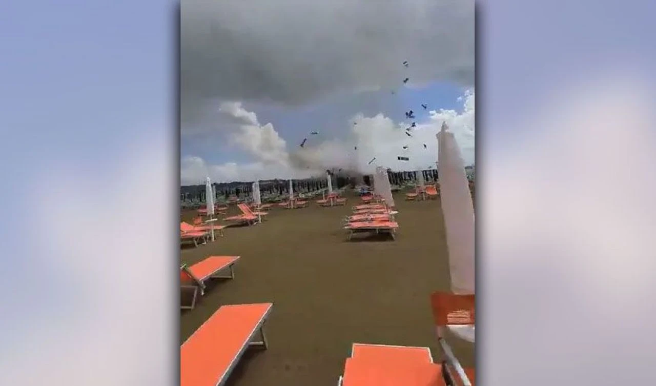 Karaya ulaşan hortum her şeyi gökyüzüne fırlattı! Uçan şezlonglar kameraya böyle yansıdı