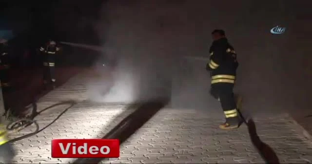Alev alev yanan aracını çaresizce seyretti