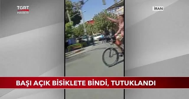 Başı açık bisiklete bindi, tutuklandı