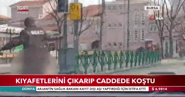 Kıyafetlerini çıkarıp caddede koştu