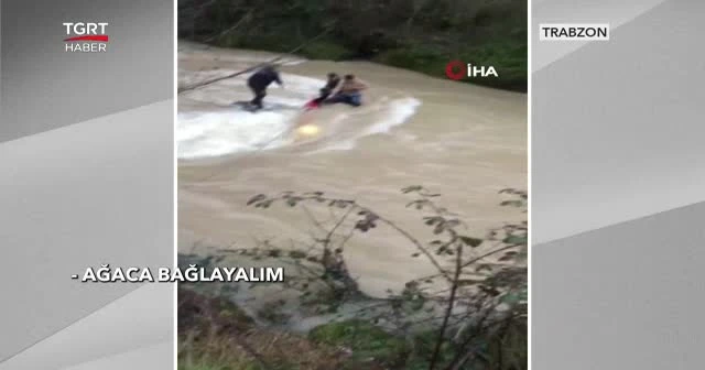 Araçları dereye uçan 3 genç iple kurtarıldı