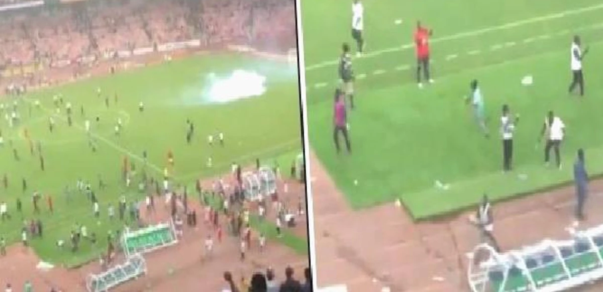 Nijerya'da taraftalar sahayı bastı: Futbolcuları kovaladı