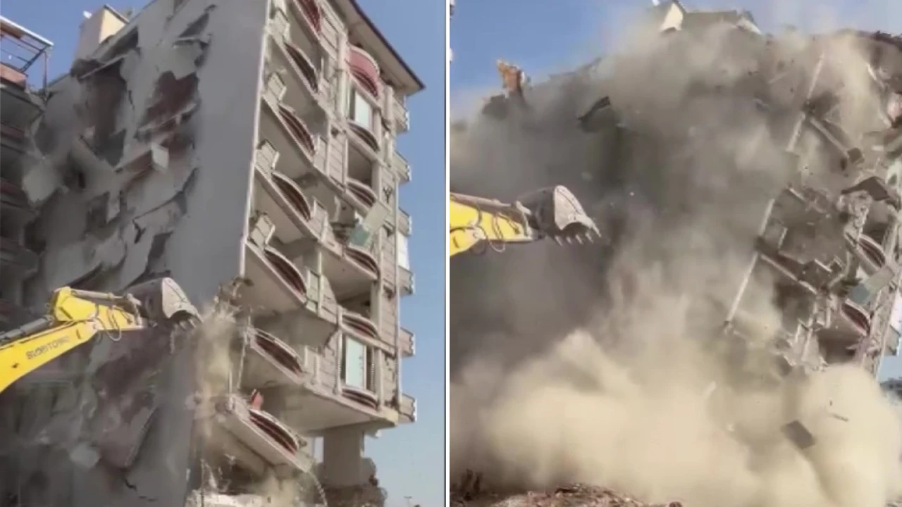 Hatay'da iş makinesiyle yıkılan hasarlı binalar kamerada