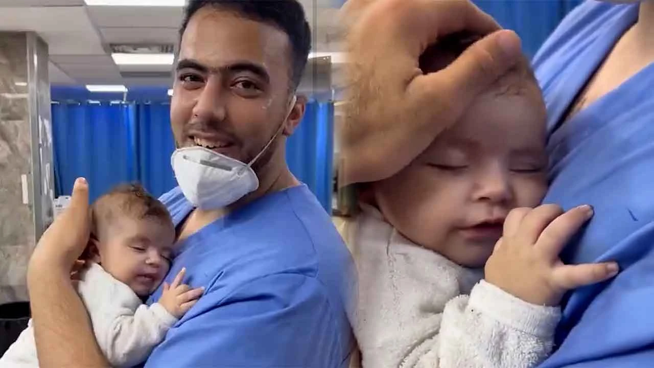 Gazze'de yürek ısıtan görüntü! Sağ kurtarılan bebek sağlık çalışanın kucağında gülümseyerek uyudu