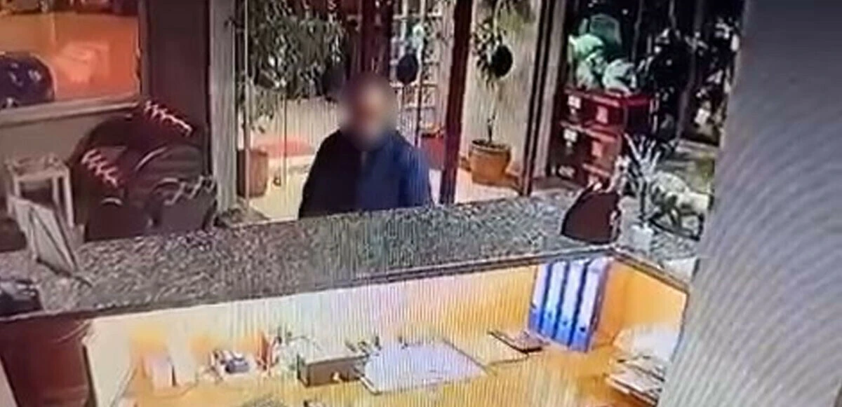 Zıp zıp hırsız kamerada: 10 saniye asılı kaldı, 40 bin liralık telefonu cebe attı